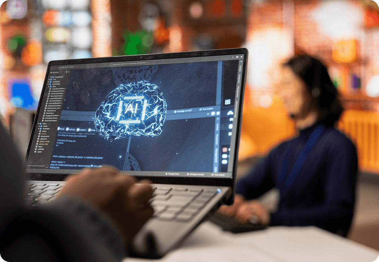 Developer working on AI software on a laptop