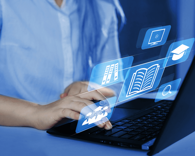 Laptop with floating education icons