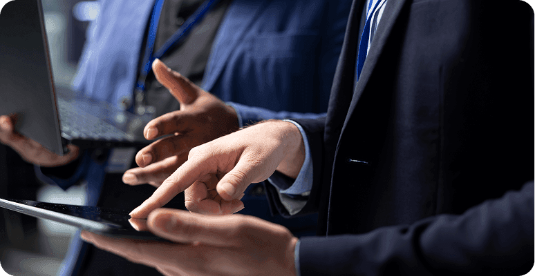 Business professional using a tablet during a meeting