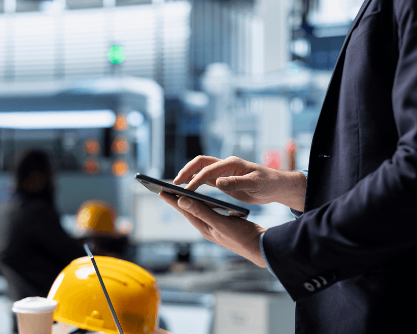 Man using a smartphone at a work site