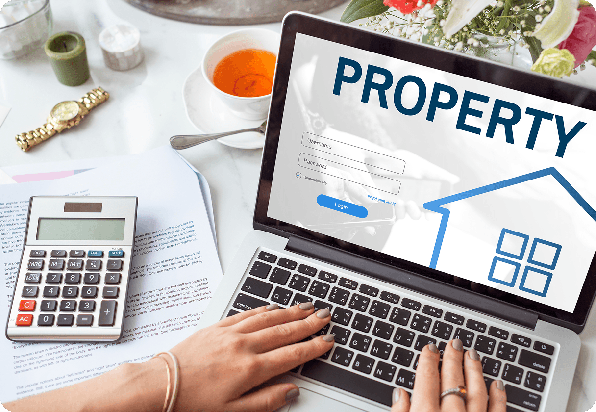 Person managing property information on a laptop