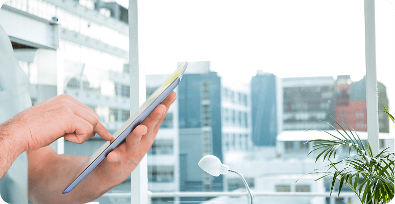 Business professional using a tablet during a meeting
