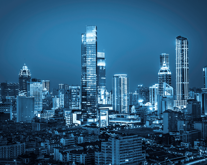 City skyline with tall buildings at night