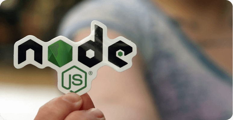 Hand holding a Node.js sticker