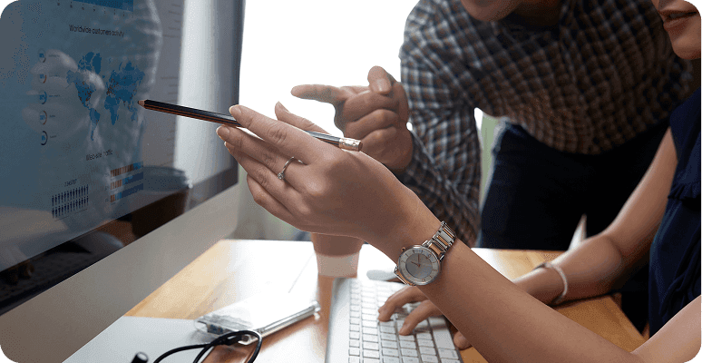 People discussing data analysis on a computer screen
