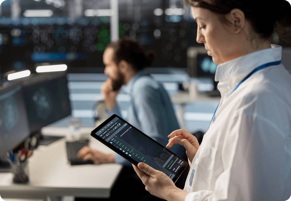 A woman is working on an iPad